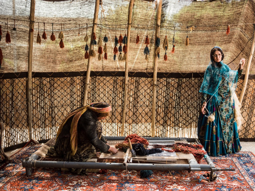 woman working rugs